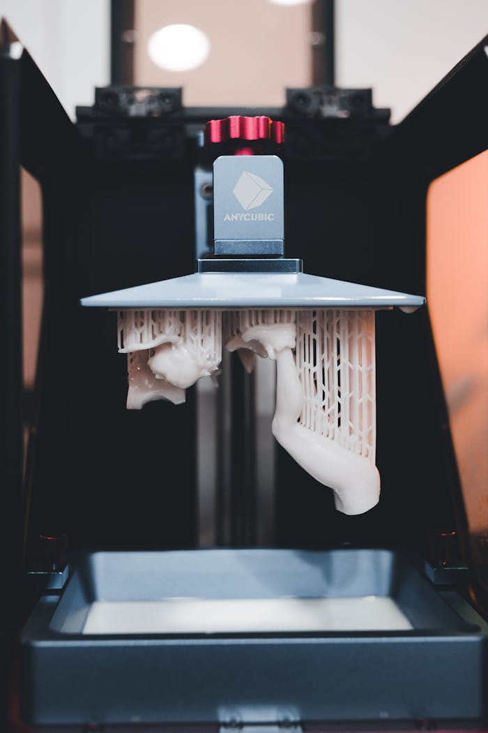 High-quality close-up of a 3D printer printing an object with resin.
